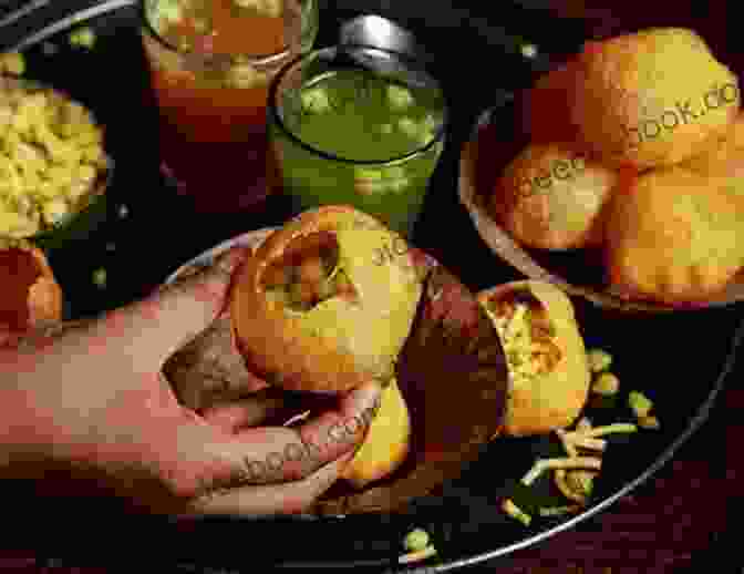 A Street Vendor In Mumbai Prepares Delicious Pani Puri, A Popular Indian Snack. Masala Memories: Travels In The Land Of Colour